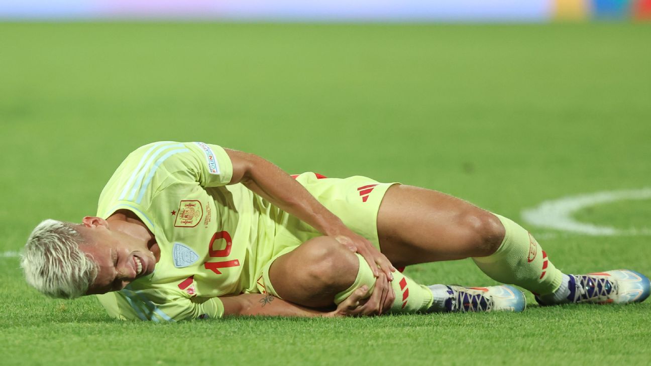 Spain forward Dani Olmo returns to Barcelona with knee injury