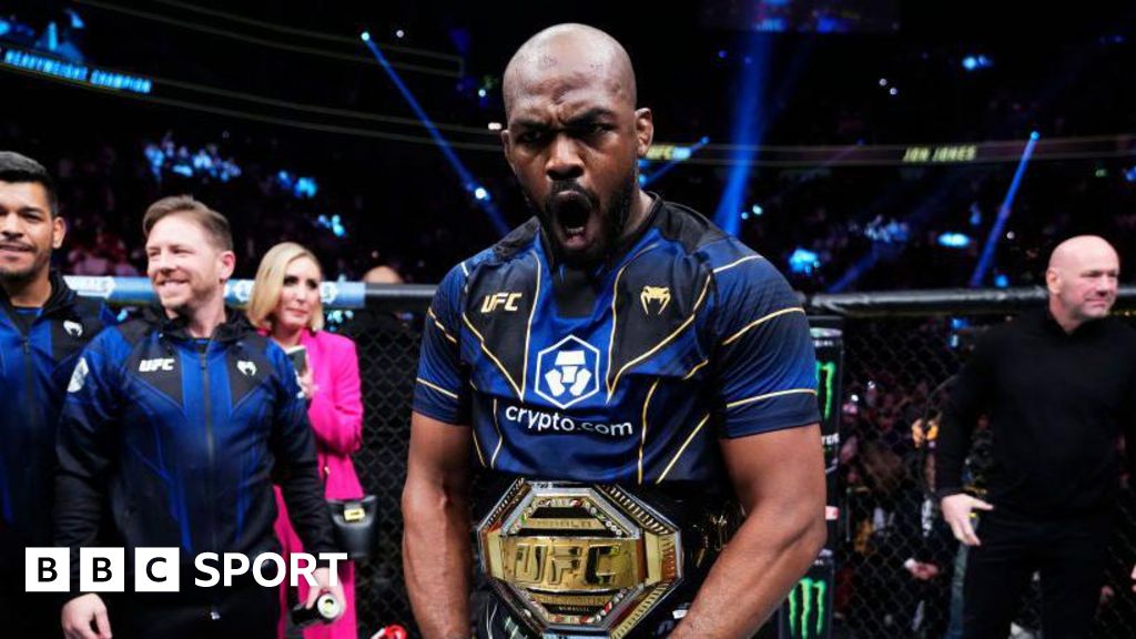 Jon Jones celebrates winning the UFC heavyweight title after beating Ciryl Gane at UFC 285 in March 2023