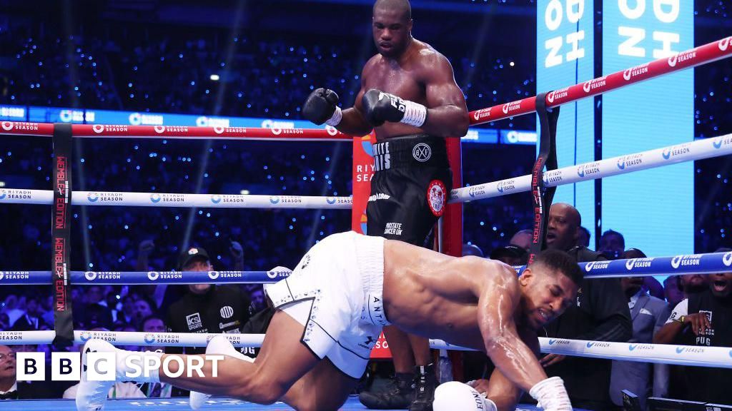 Anthony Joshua hits the canvas with Daniel Dubois over him