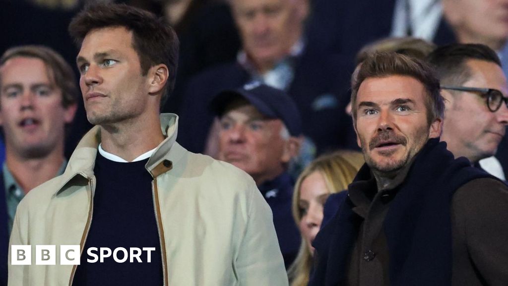 Tom Brady (L), minority owner of Birmingham City stood next to David Beckham