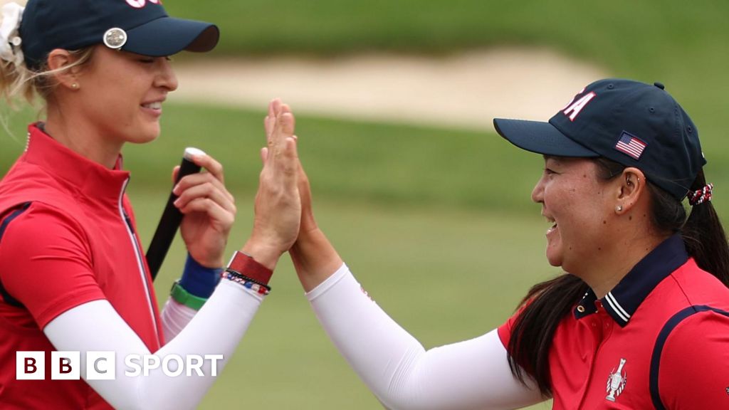 Nelly Korda and Allisen Corpuz high-five after winning their foursomes match on Friday at the Solheim Cup