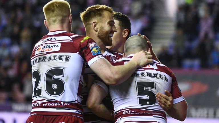 Wigan celebrate a try as they claimed the League Leaders' Shield with a win over Salford